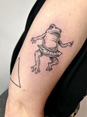 Get inspired by this playful illustrative tattoo of a frog in a tutu, beautifully designed by Jonathan Glick.