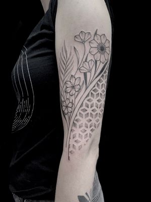 Unique tattoo design by Rose Harley combining dotwork, geometric shapes, and flowers for a stunning and intricate piece of art.
