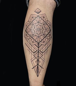 Experience intricate blackwork and dotwork design in this fine_line geometric mandala tattoo by artist Rose Harley.