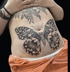 Experience the intricate beauty of dotwork with this illustrative butterfly tattoo by talented artist Rose Harley.