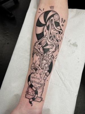 Get a quirky and colorful Beetlejuice tattoo by the talented artist Jonathan Glick. Stand out with this unique design!