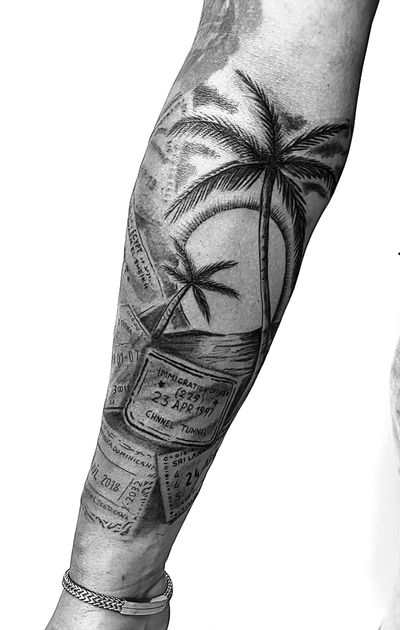 Get a taste of vacations with this black and gray tattoo featuring palm tree stamps by Gabriele Lacerenza.