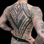 Experience the artistry of Rose Harley with this stunning blackwork and ornamental tribal pattern tattoo. Perfect for those who appreciate intricate designs.