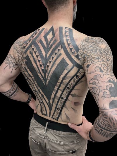 Experience the artistry of Rose Harley with this stunning blackwork and ornamental tribal pattern tattoo. Perfect for those who appreciate intricate designs.