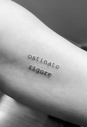 Express your love for small tattoos with this delicate lettering design by the talented artist Gabriele Lacerenza.