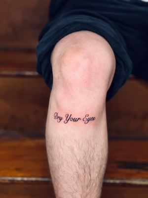 Get a unique and stylish small lettering tattoo done by the talented artist Tal. Perfect for adding a personal touch to your body art!