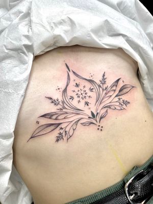 Elegant and intricate flower design expertly executed by tattoo artist Beyza Taser in an ornamental and illustrative style.