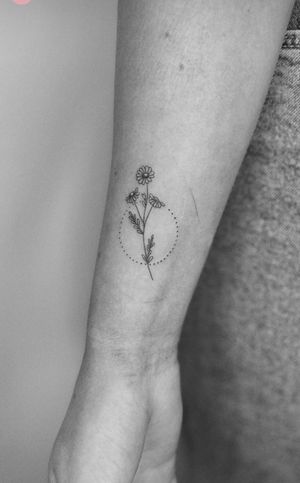 Discover the delicate beauty of this fine line flower tattoo created by the talented artist Math. A timeless addition to your body art collection.