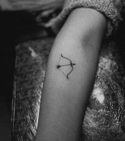 Get a beautifully crafted illustrative tattoo of a delicate arrow and bow design by the talented artist Math.