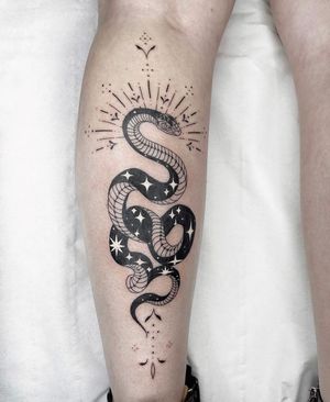 Experience the allure of this illustrative blackwork snake tattoo, expertly crafted by the talented artist Beyza Taser.