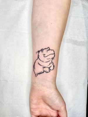 Get a unique hippo design by talented artist Beyza Taser in illustrative style. Stand out with this charming tattoo!