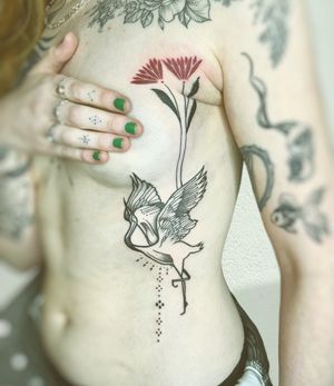 Exquisite tattoo design featuring a beautiful flower, crane, and heron by the talented artist Beyza Taser.