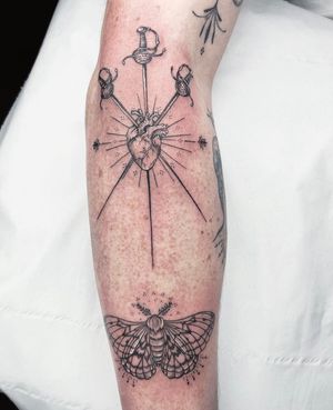 Unique black & gray tattoo design by artist Beyza Taser, featuring a moth, heart, and sword motifs.