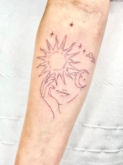 Experience the beauty of nature with this fine line, illustrative tattoo featuring the sun and moon by talented artist Beyza Taser.