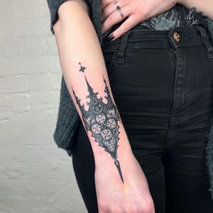 Get a bold and detailed illustrative blackwork pattern tattoo created by the talented artist Hellie.