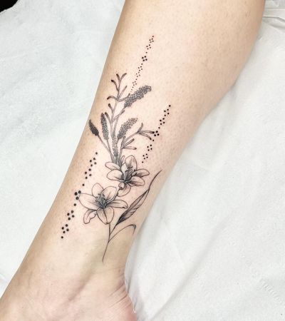 Elegant and detailed flower tattoo crafted in fine line illustrative style by talented artist Beyza Taser.