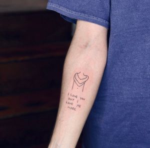 Express your self love with this beautiful fine line and illustrative tattoo by Tal. A delicate and powerful reminder to love yourself.