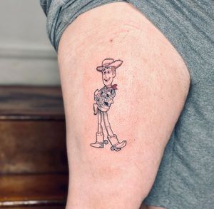Get a whimsical Toy Story tattoo featuring Woody in a unique illustrative style by the talented artist Tal.