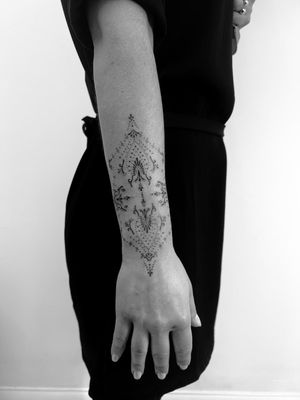 Discover the beauty of delicate and dainty ornamental tattoo art created by the talented artist Math. Adorn your skin with intricate designs that exude elegance and sophistication.