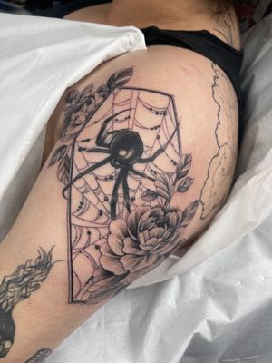 Illustrative tattoo by Beyza Taser featuring a spider and flower motif, perfectly blending creepiness with beauty.