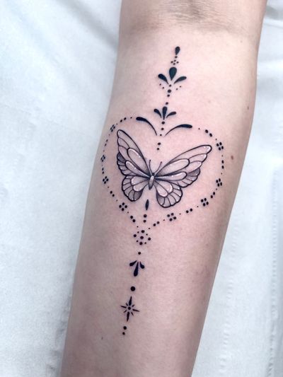 Intricate blackwork butterfly design by talented artist Beyza Taser, combining ornamental and illustrative elements.