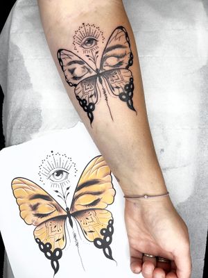 Elegant blackwork tattoo of an abstract butterfly by the talented artist Beyza Taser. Unique and stylish design.