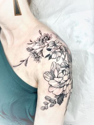 Elegant and detailed floral design by talented artist Beyza Taser, perfect for those looking for a delicate and stylish tattoo.