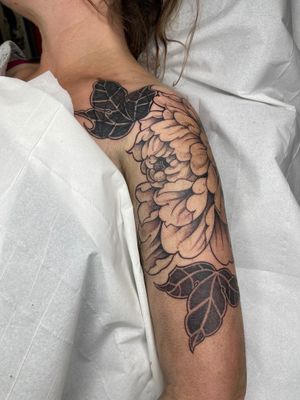 Exquisite blackwork and dotwork tattoo featuring illustrative chrysanthemum design by talented artist Beyza Taser.