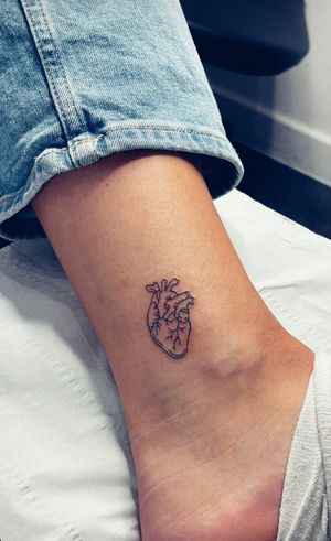 Express your love with a unique illustrative heart tattoo by the talented artist Tal. A beautiful and timeless design for your body art collection.