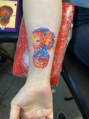 Amazing tattoo of a cell dividing in to two with use of technical watercolour technique by the amazing Eve 