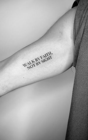 Express yourself with a custom lettering tattoo featuring a powerful quote by Math. Let your words make a lasting impression.