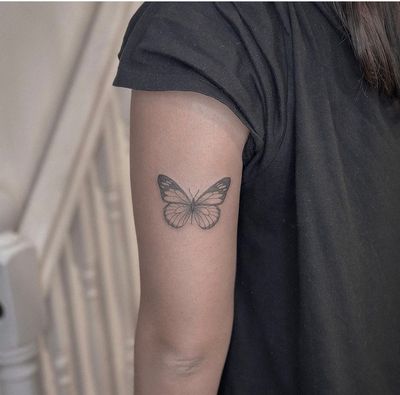 Get a beautiful illustrative butterfly tattoo by Monike, showcasing delicate and detailed design. Perfect for those who love elegant and feminine tattoos.