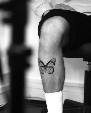 Get a stunning illustrative butterfly tattoo designed by Victoria for a timeless and feminine look.
