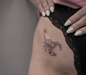 Capture the beauty and strength of a scorpion in this intricate and delicate illustrative tattoo by the talented artist Monike.