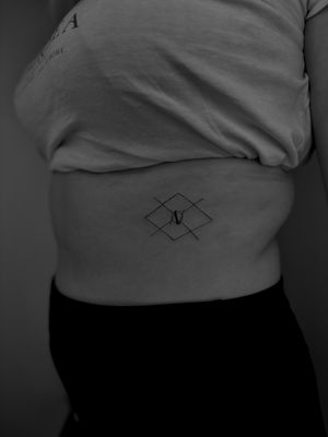 Explore the beauty of fine lines and geometric shapes with this stunning tattoo by Ruth Hall. Perfect for those who appreciate simplicity and precision.