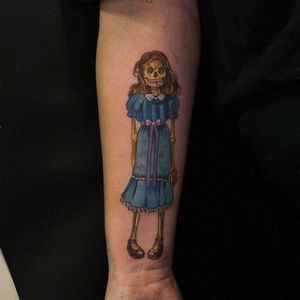 Get spooked with this illustrative tattoo inspired by The Shining, featuring bold colors. By artist Holly Valley.