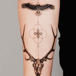 Unique black and gray design by Gabriele Edu combining geometric shapes and fine line details to create a stunning deer motif tattoo.