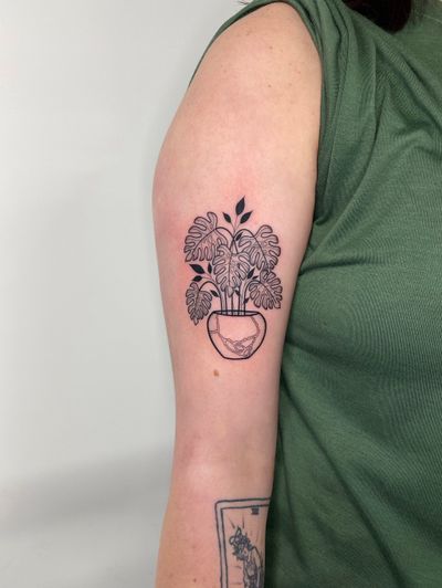 Blackwork design by Joanna Webb featuring a vase with monstera plant for a bold and artistic tattoo.