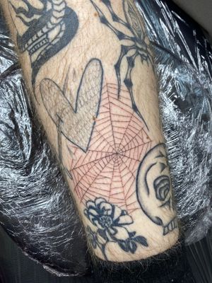 Get caught in the intricate beauty of this illustrative spider web tattoo by artist Charlie Macarthur.