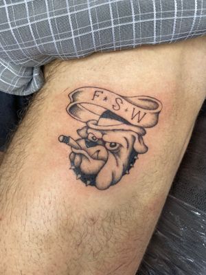 Get inked with a classic illustrative design by the talented Charlie Macarthur. This tattoo features a bold bulldog and a tough cigar.