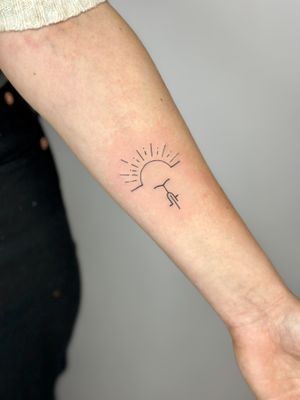 Get inspired by the beauty of a sunset with this fine line hand-poked bicycle tattoo by jadeshaw_tattoos.