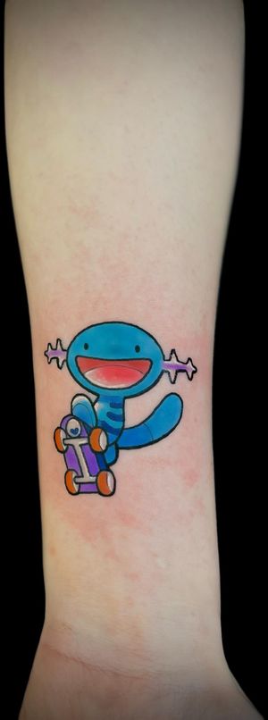 Experience the ultimate fusion of Pokemon, Wooper, and skate culture in this vibrant anime tattoo. Created by the talented artist Ben Twentyman.