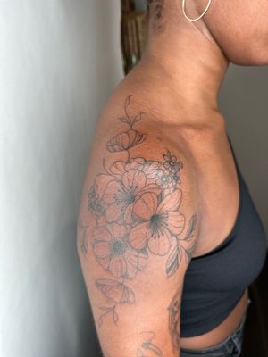 Beautiful flower design for dark skin by jadeshaw_tattoos, showcasing intricate details and delicate lines.