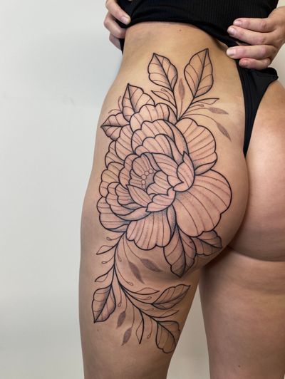 Admire the intricate details of this illustrative peony flower tattoo that showcases Joanna Webb's exceptional talent in tattoo artistry.