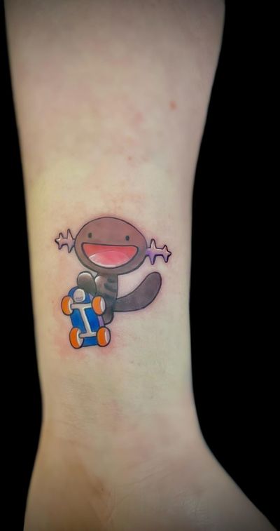 Get inked with this cool anime tattoo featuring a playful Wooper from Pokemon, designed by the talented artist Ben Twentyman.