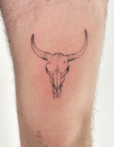 Unique fine line illustrative tattoo design featuring a cow skull, bull, and ox motifs by Saka Tattoo.