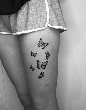 Embrace the beauty of nature with this illustrative butterfly tattoo in bold blackwork style by talented artist Oliver Soames.