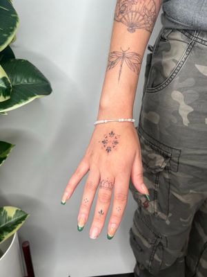 Discover the intricate beauty of this dainty ornamental tattoo masterpiece by renowned artist Emma InkBaby. Perfect for those seeking a touch of elegance and sophistication in their body art.