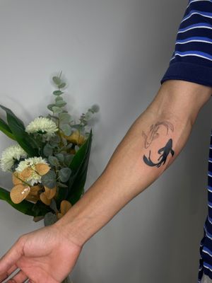 Emma InkBaby's unique design combining a fish and koi with a ying yang symbol in an illustrative style.