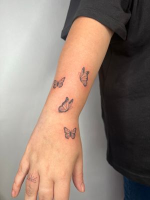 Featuring a stunning illustrative design of a delicate butterfly by Emma InkBaby, this tattoo is sure to stand out.